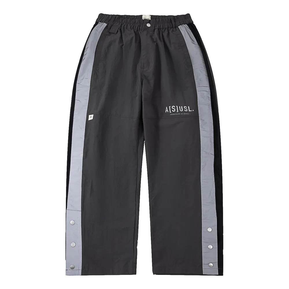 A[S]USL REFLECTIVE LOGO TRACK PANTS-CHARCOAL